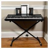 Piano keyboard, PSR-E433, in good working condition on adjustable stand. With original box; h. 30-1/