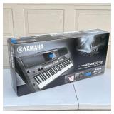 YAMAHA ELECTRIC KEYBOARD | Piano keyboard, PSR-E433, in good working condition on adjustable stand. 