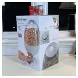 BROOKSTONE SNACK ITEMS | Including a SnackMan motion-activated treat dispenser and a CandyMan power 