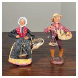 PAIR FRENCH POTTERY FIGURES | Man and woman with scales, each signed S. Peiraho; h. 11 in.