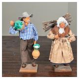 PAIR FRENCH POTTERY FIGURES | Including a man with pitchers and a woman carrying sticks, each on a w