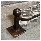 JAN BARBOGLIO VOTIVE HOLDER | Wrought iron frame suspending glass candle holders; h. 5 x w. 41 in.