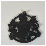 KINGS ARMS TRIVET | Painted cast iron with the royal coat of arms; dia 6 inches