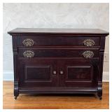 Antique side cabinet having two full-width drawers with fancy openwork brass pulls over double cabin