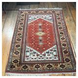 GEOMETRIC MEDALLION RUG  | Central rust colored medallion on a cream field, with a border of flowers