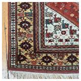 Central rust colored medallion on a cream field, with a border of flowers and other devices; 8 ft. x