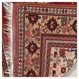 GEOMETRIC MEDALLION RUG  | Central rust colored medallion on a cream field, with a border of flowers