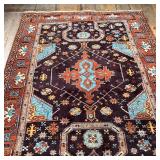 With central rust and teal medallion, intricate patterns and colorful embellishments; 7ft 11 in. x 5