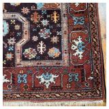COLORFUL GEOMETRIC RUG | With central rust and teal medallion, intricate patterns and colorful embel