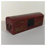 Long document box with brass hardware, dome top, decorated with gilt scenes of figures and landscape