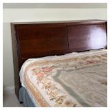CUSTOM WALNUT HEADBOARD | Bespoke headboard cabinet with two fold-down doors, interior with empty sp