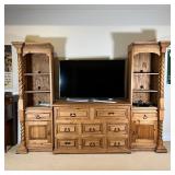 WOOD ENTERTAINMENT CENTER | Three section entertainment center, comprising a middle chest of 8 drawe