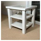 White Restoration Hardware side table with glass top insert and two lower shelves; h. 24 x 23 x 23 i