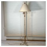 GILT FLOOR LAMP | Gilt framed floor lamp with tripod legs and french finial, tested and works; h. 60