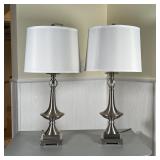 PAIR BRUSHED METAL COLUMN LAMPS | Contemporary table lamps with brushed metal and clear glass orbs, 