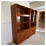 modern design, including an open bookshelf with lower cabinet doors and a display cabinet with smoky