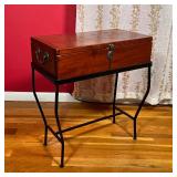 SIDE TABLE / MINI CHEST | A small chest with a hinged lid sitting atop a metal wire frame, can be us