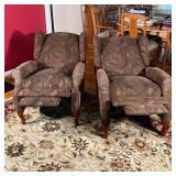 reclining armchairs having textured paisley upholstery, fronted by two short cabriole legs, with pop
