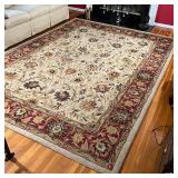 FLORAL AREA RUG | Floral design over tan field with red flower bud border; 10 ft. 10 in. x 7 ft. 10 