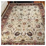 FLORAL AREA RUG | Floral design over tan field with red flower bud border; 10 ft. 10 in. x 7 ft. 10 