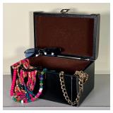 LEATHER BOX of COSTUME JEWELRY | Mostly pooka shells, etc, and a pair of sunglasses, in a black hing