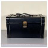 pooka shells, etc, and a pair of sunglasses, in a black hinged lid box