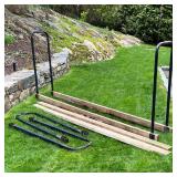 PAIR LOG HOLDERS | Two 8 ft long log holders with 45 in. tall metal sides [one log holder has been d