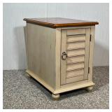 SIDE TABLE CABINET | End table with a cabinet door and a magazine holder on the opposite end; h. 23-
