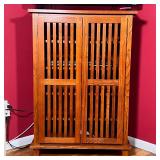 WOOD MEDIA CABINET | Small media / storage cabinet with two vertical slatted doors revealing 5 shelv