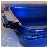 Anchor Ovenware baking pans, assorted strainers, two aluminum baking tins, large assortment of measu