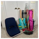 GROUP VINTAGE BEACH GEAR | Including a life vest, pool noodle, beach umbrella, fish net, a folding c