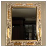 GILT WALL MIRROR | Very large gilt carved wall mirror with floral scrollwork carved accents and beve