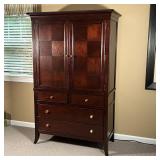 STANLEY FURNITURE ARMOIRE | Dark wood dresser cabinet with two checkered doors with contrasting wood