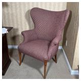 WINGBACK ARM CHAIR | Fabric upholstery with carved wood sabre legs; h. 40 x 33 x 32 in.