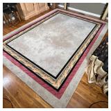 COLORBLOCK AREA RUG | Custom-made carpet with a mostly grey-tan field and a black and braided red mi