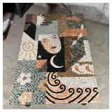 Mosaic low table depicting a woman