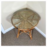 RATTAN SIDE TABLE | Rattan / cane spiral side table with a round glass top and medial shelf; dia. 24