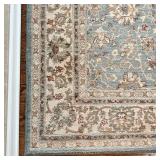 KARASTAN CARPET | Light blue ground with a medallion center within tan borders, "capri-robbins egg" 