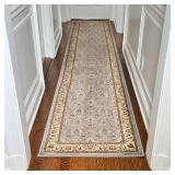 CONTEMPORARY RUNNER | Hallway carpet having a light blue ground with overall field of tan floral spr