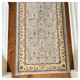 Hallway carpet having a light blue ground with overall field of tan floral sprays; 12 ft. x 2 ft. 4 
