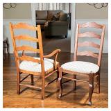 armchairs and four side chairs, solid wood ladder back chairs with cushioned seats upholstered in a 