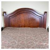 Queen-size bed frame of solid wood with arched headboard, of nice quality and appearing in overall v
