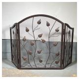 FIREPLACE SCREEN | Black fireplace screen in three panels, decorated with leafy vines; h. 31 x 48 in