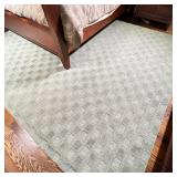 GREEN PATTERN AREA RUG | Textured patterned area carpet, appearing in overall good condition; 11 ft 