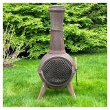 CAST IRON CHIMINEA | Chimney-form outdoor wood burning fire pit, on three legs; h. 46 in.