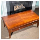 wood finish with two drawers over square tapering legs and appearing in very good condition; h. 17-3