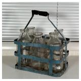 MILK BOTTLES & CARRIER | Six bottle carrier with five R.J. Sayre glass bottles and a Ronny Brook bot
