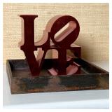 LOVE SCULPTURE | Robert Indiana authorized reproduction, red metal "LOVE" sculpture on a metal stand