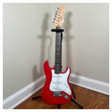 FENDER SQUIER ELECTRIC GUITAR | Red and white guitar on an On-Stage Stand (guitar h. 34-1/2 in.) [mi