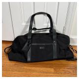 KENNETH COLE DUFFLE BAG | Black duffle bag with leather straps and accents, appearing in very good c